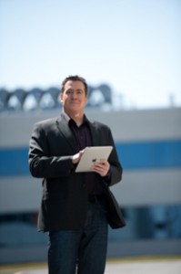 internet safety expert Terry Cutler with digital locksmiths holding ipad
